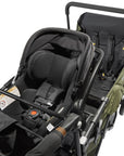 car seat installed on the caravan quad in army green color