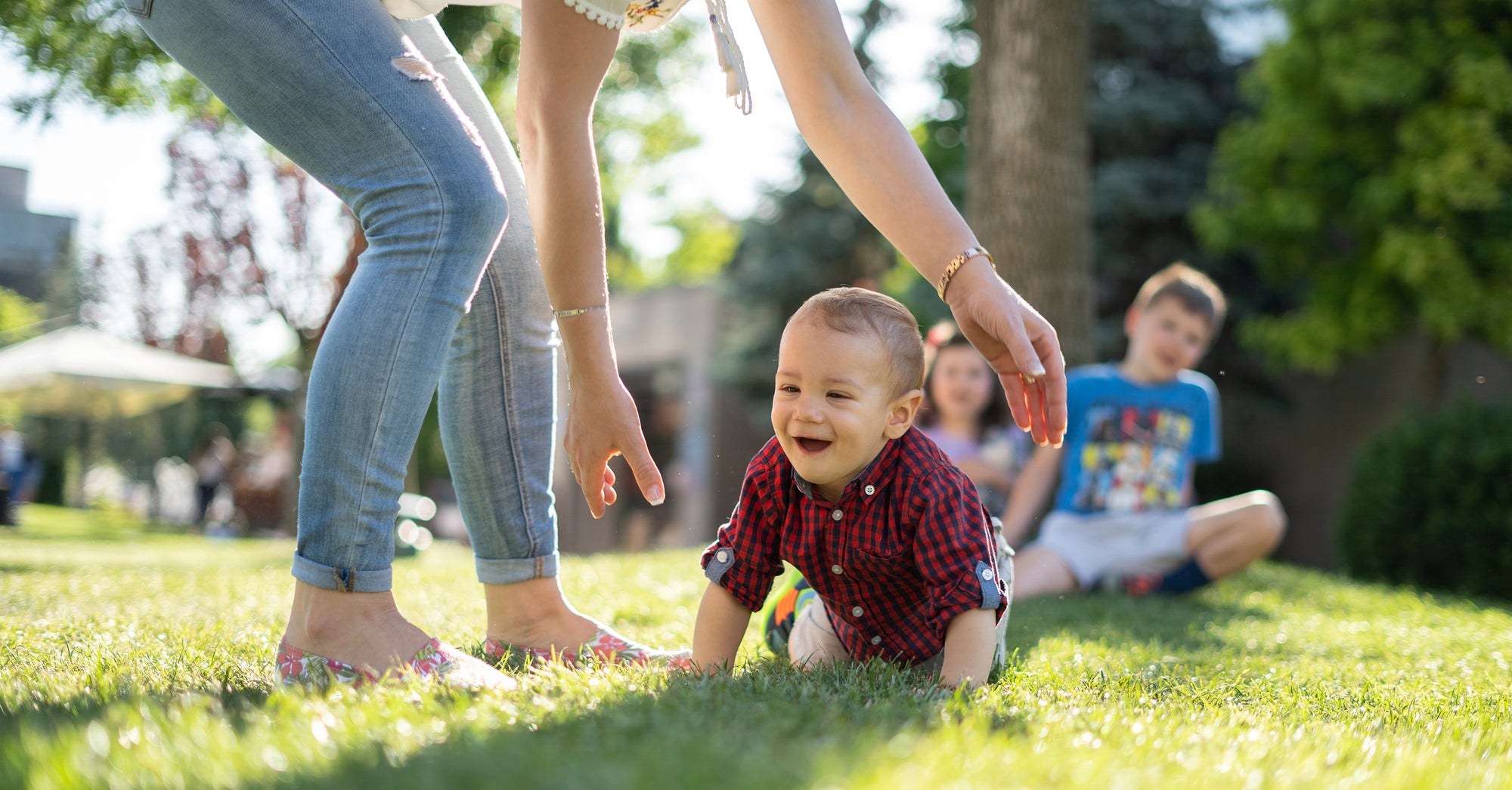 baby crawls in the grass