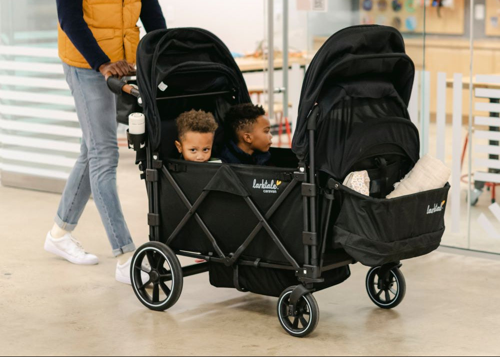 children riding in the caravan quad