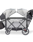 larktale caravan v3 stroller wagon in avalon gray side angle with reclined seats