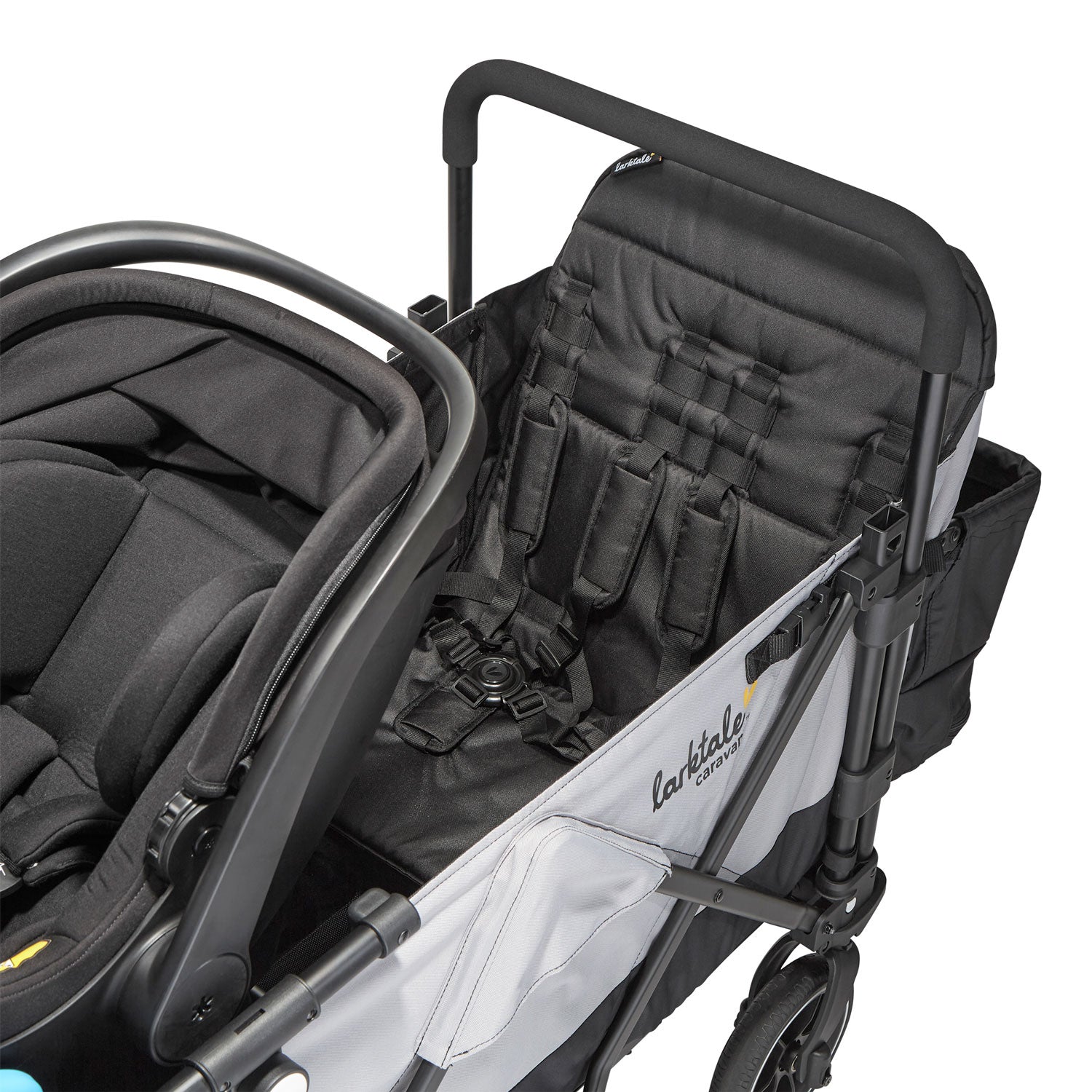 caravan double seat with with infant car seat also attached to the wagon