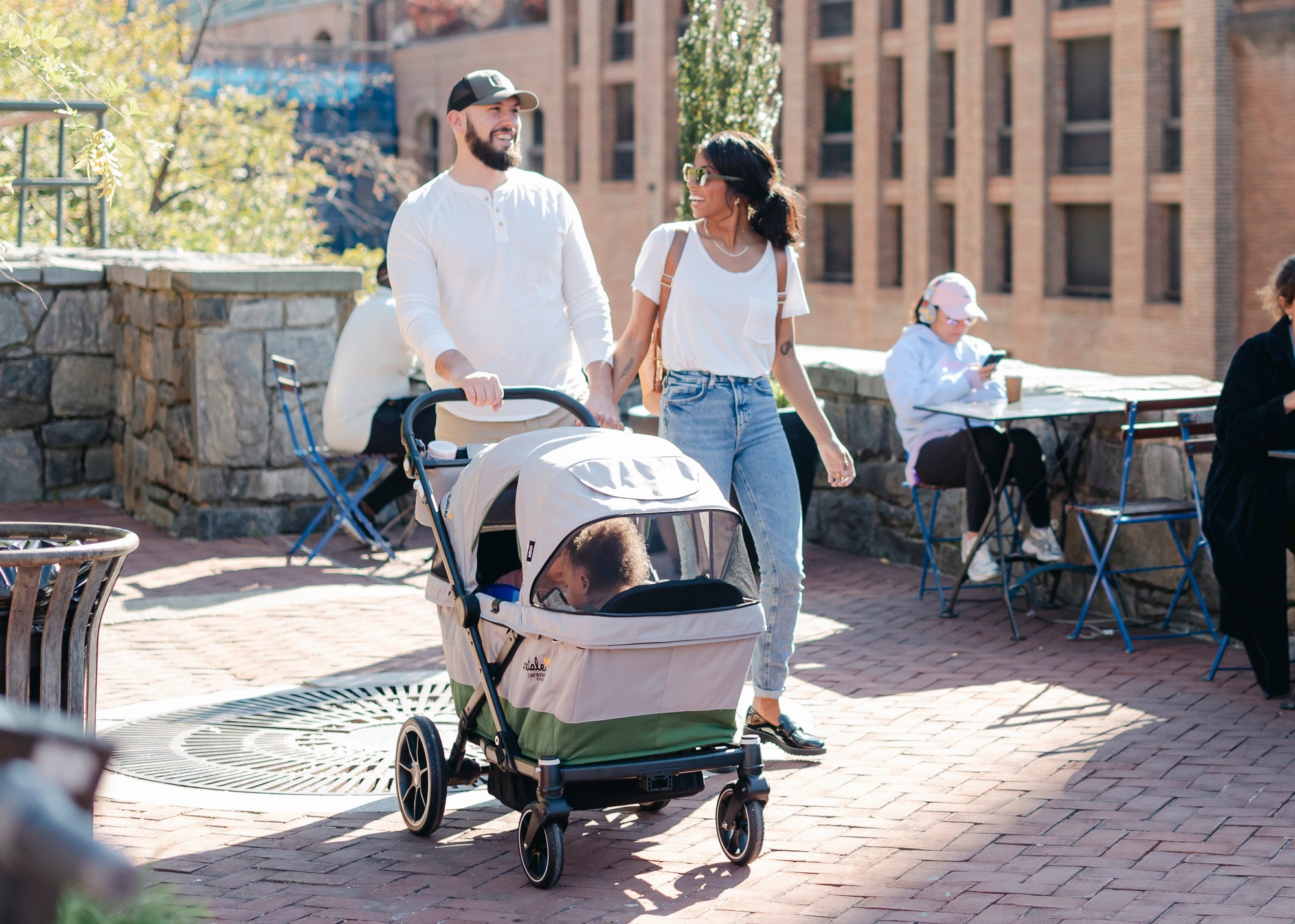 parents walking with caravan coupe