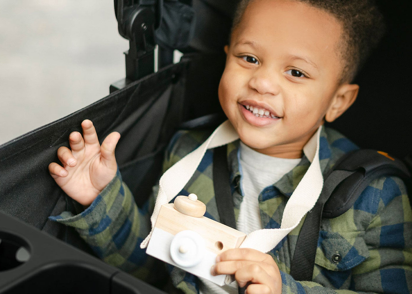kid in the caravan smiling
