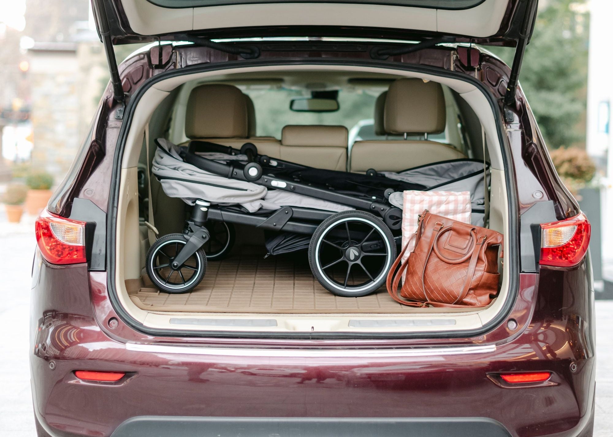 caravan coupe quad folded in the trunk of a car
