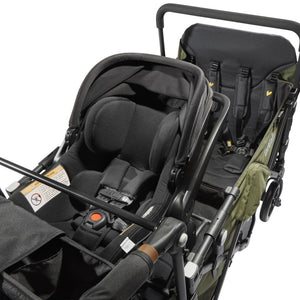 car seat installed on the caravan quad in army green color