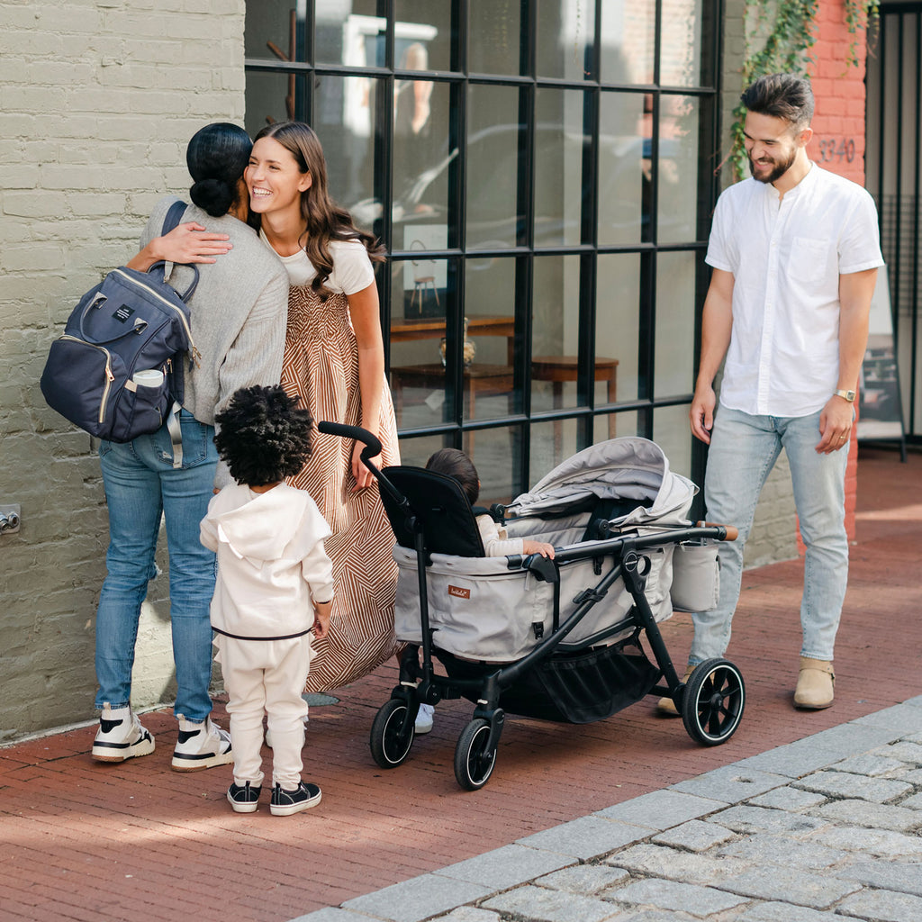 families meet up for a play date with the crossover stroller wagon in wagon mode