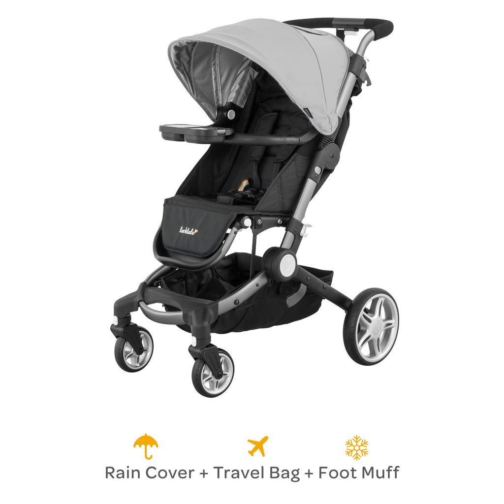 coast stroller in light gray with rain cover, travel bag and foot muff included