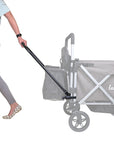 person using pull bar kit for the caravan stroller wagon