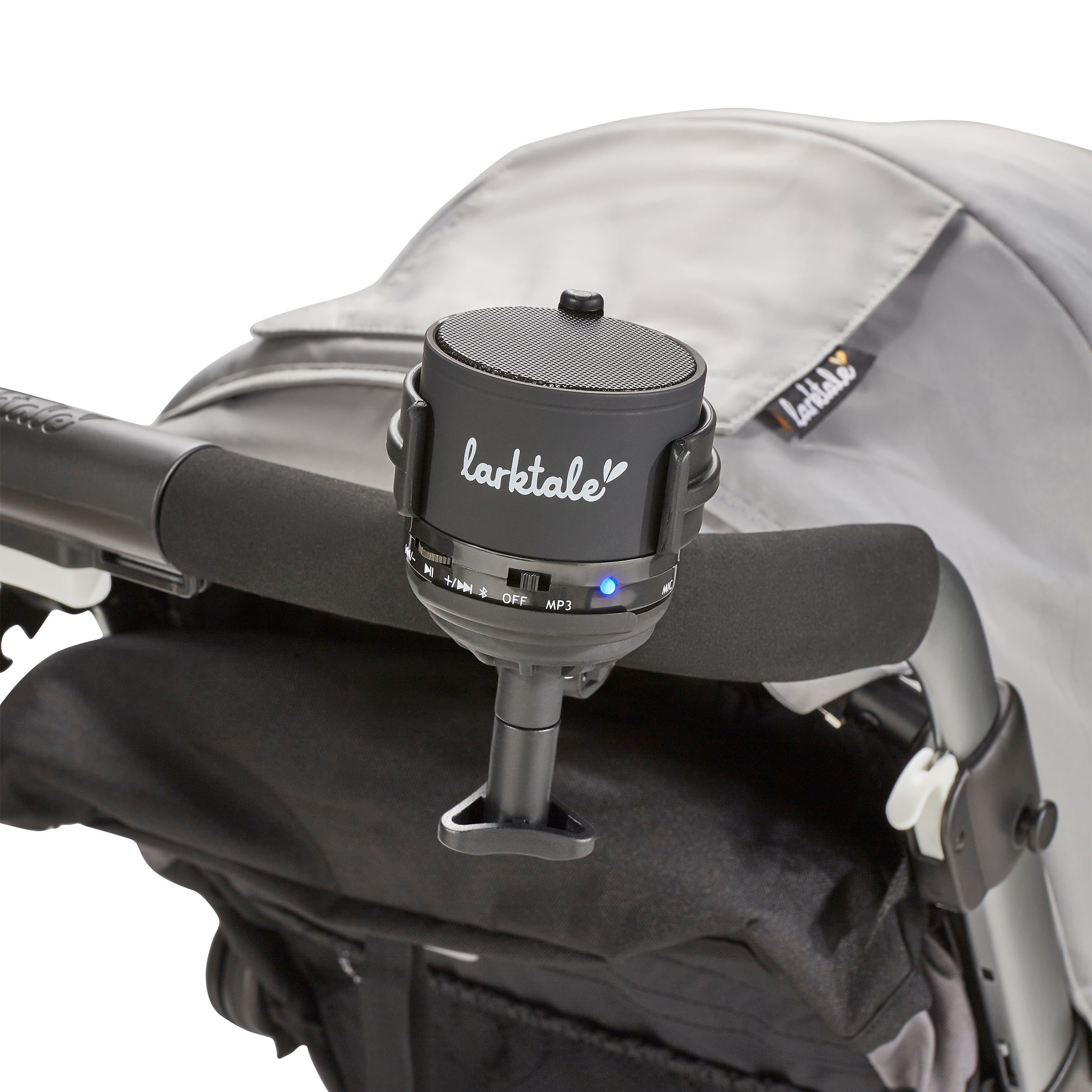 mini bluetooth speaker in black attached to stroller handlebar